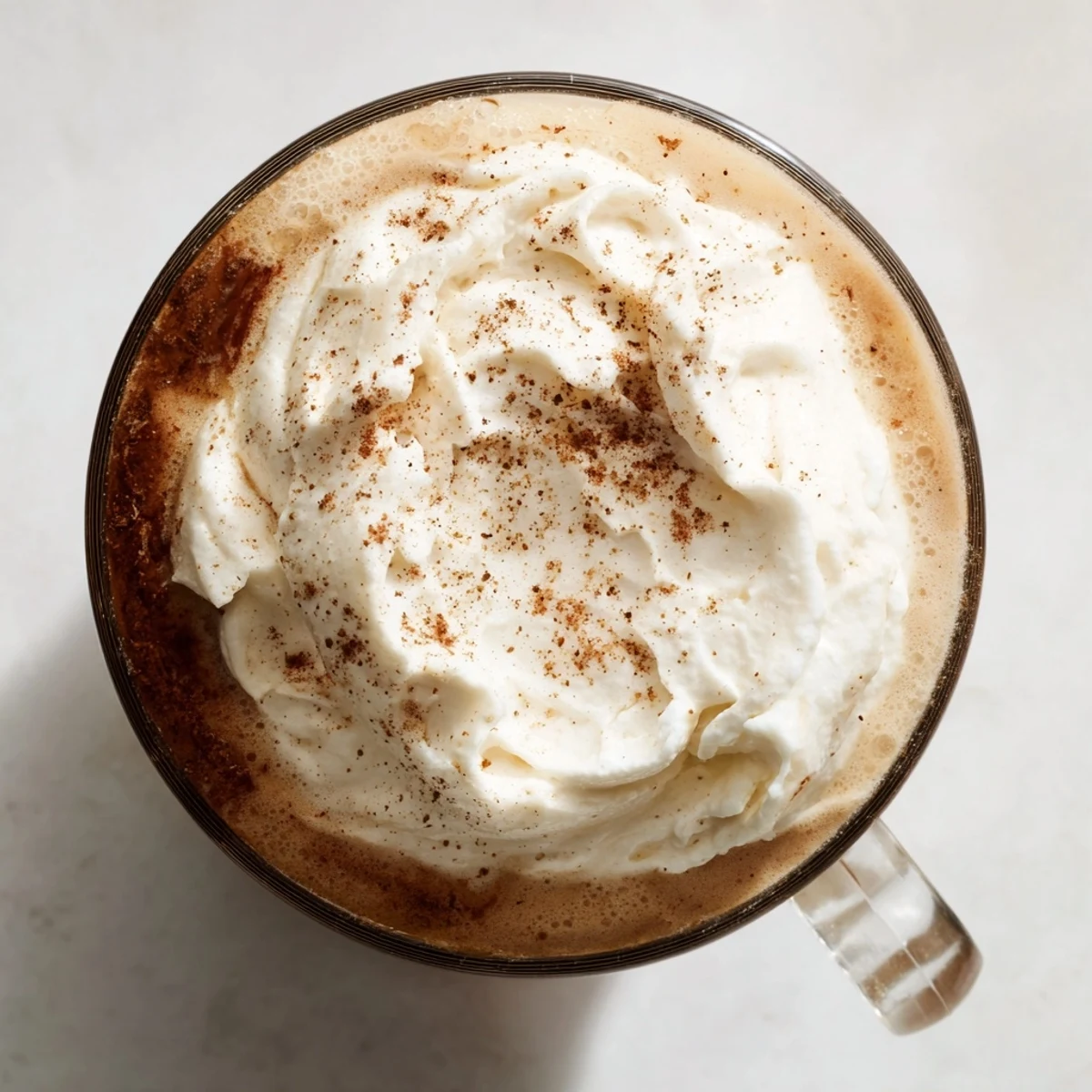 Close-up of a frothy Spiced Latte, invitingly fragrant with cinnamon and warm spices.