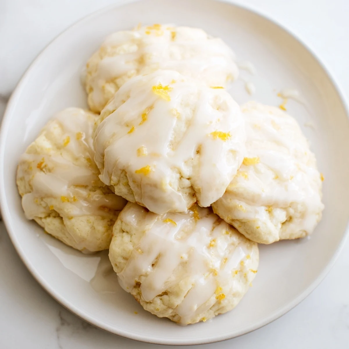 Golden-baked Lemon Ricotta Cookies drizzled with creamy lemon glaze, a delightful treat for any occasion.