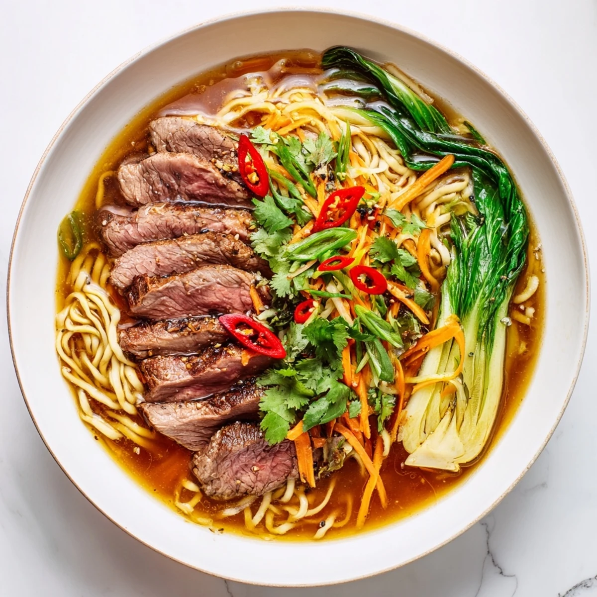 Close-up of savory Beef Noodles, showcasing the rich broth and perfectly cooked beef slices and garnishes.