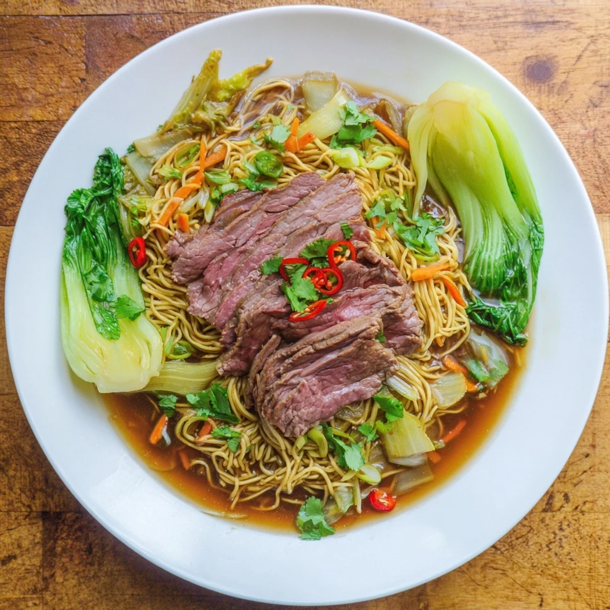Delicious and flavorful Beef Noodles featuring bok choy, carrots, and a savory broth ready to be enjoyed.