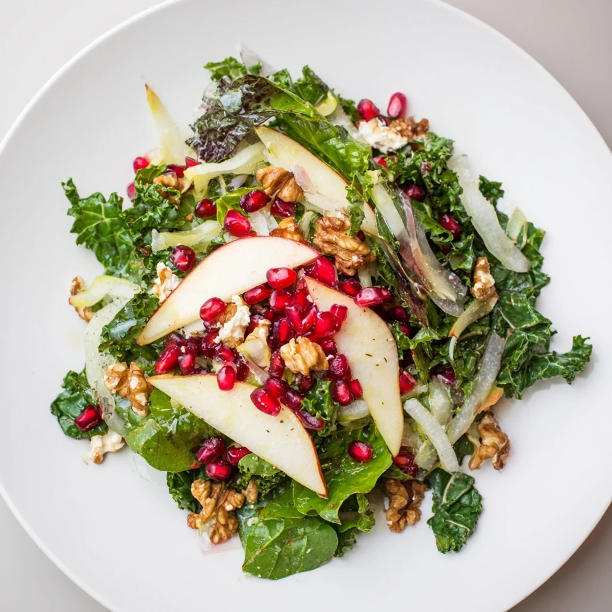Vibrant Winter Salad with Pomegranate: a colorful salad with bright red pomegranate seeds and fresh greens.