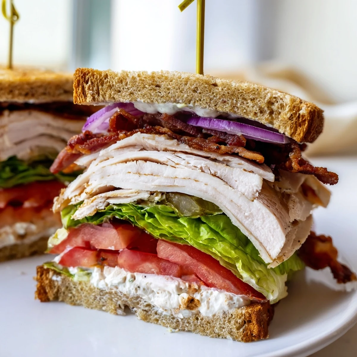 Crispy turkey bacon and sliced turkey star in this hearty Turkey Club Sandwich.