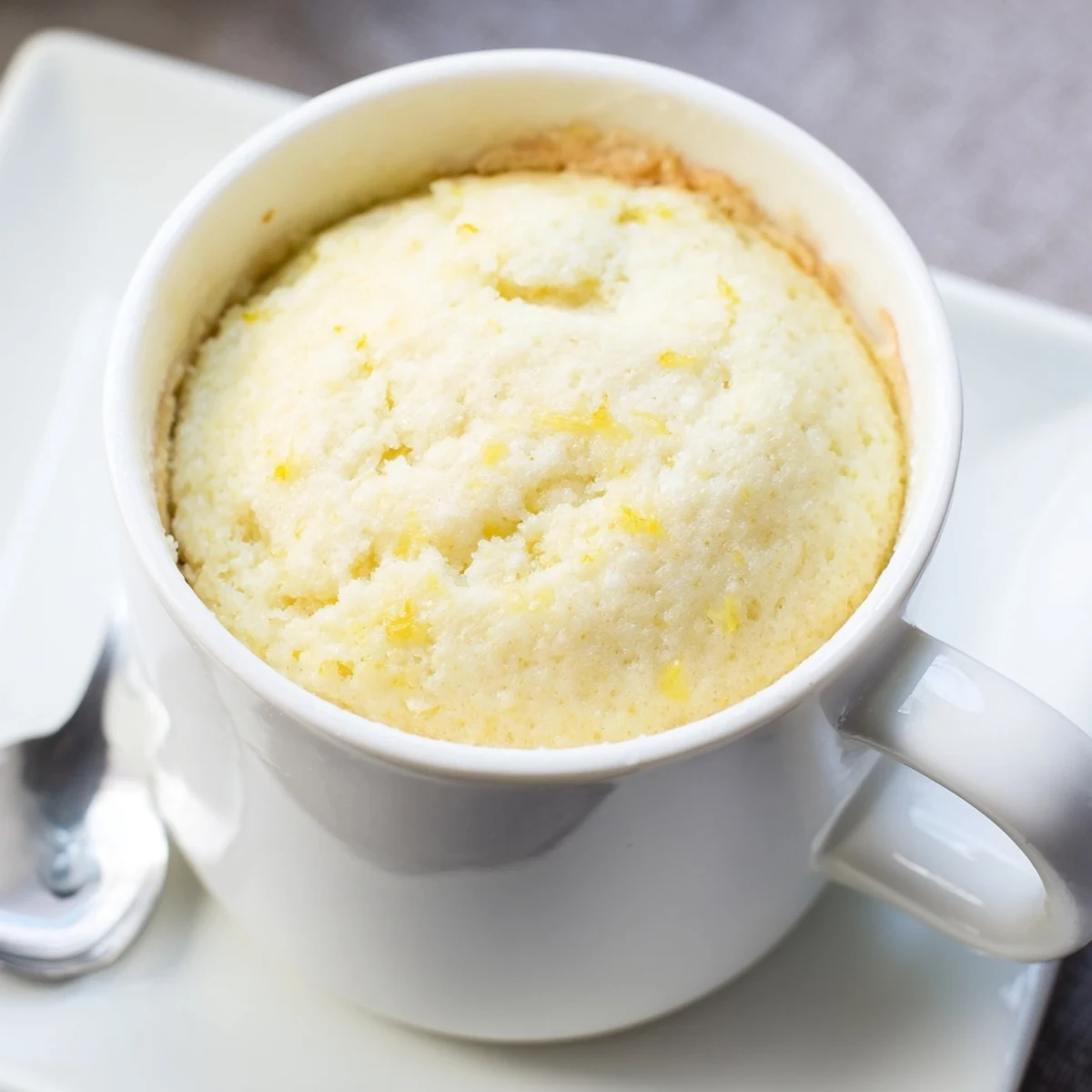 Warm Lemon Cottage Cheese Mug Cake with creamy cottage cheese texture, fresh lemon flavor, and a golden tender crumb.
