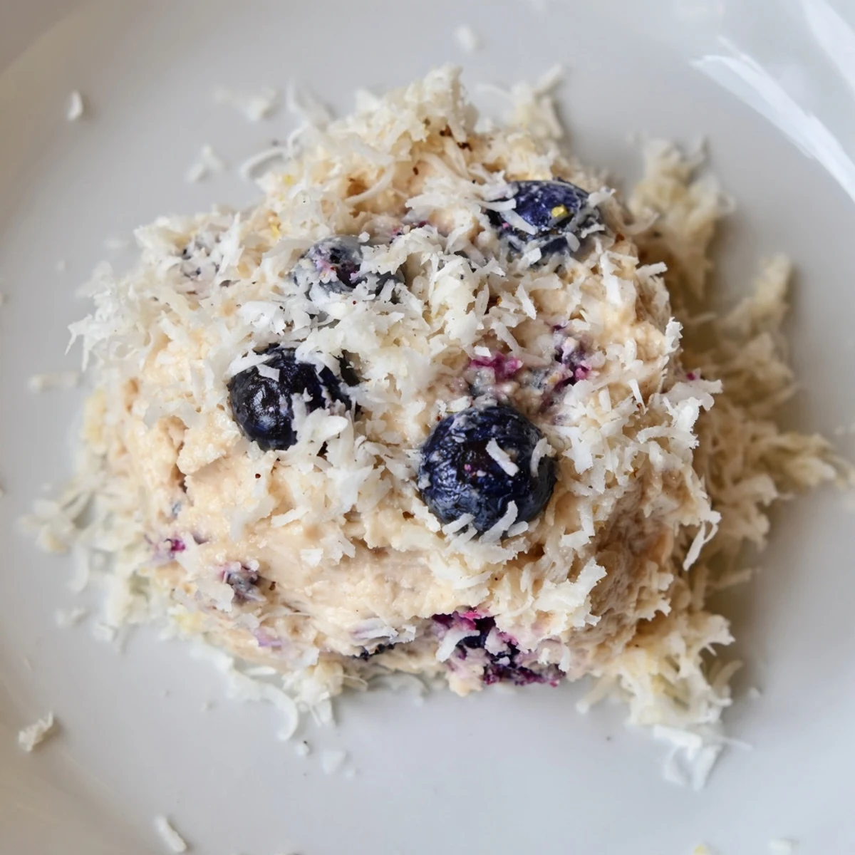 Fresh Lemon Blueberry Cottage Cheese Protein Bites arranged on a wooden serving board.