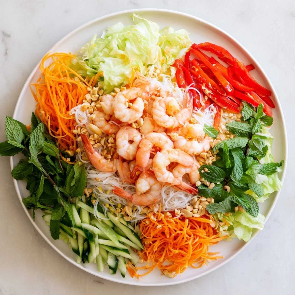 Fresh Vietnamese-style Spring Roll Salad featuring crisp vegetables rice noodles and zesty ginger lime dressing