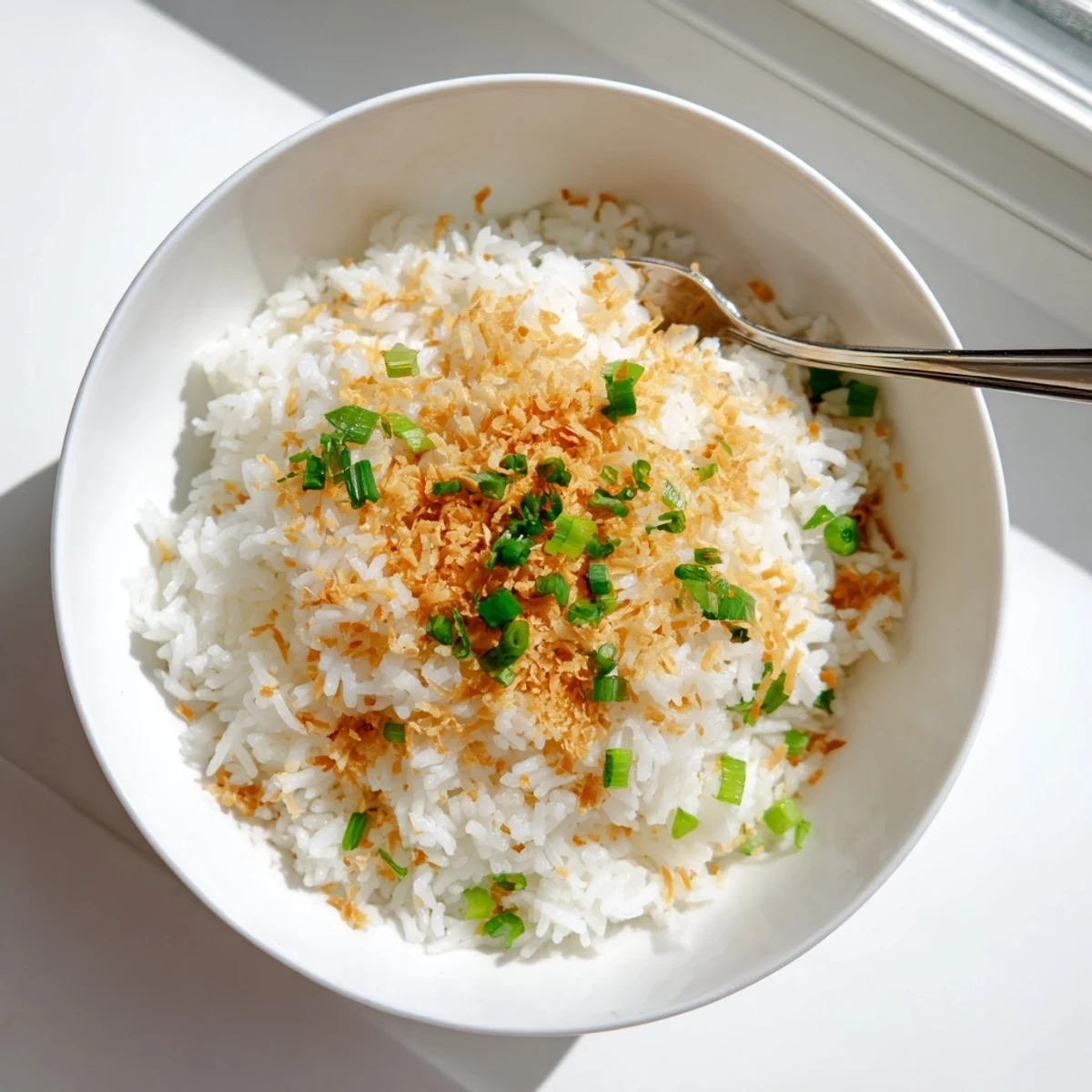 Steamy jasmine coconut rice perfectly cooked to tender perfection alongside a main curry dish