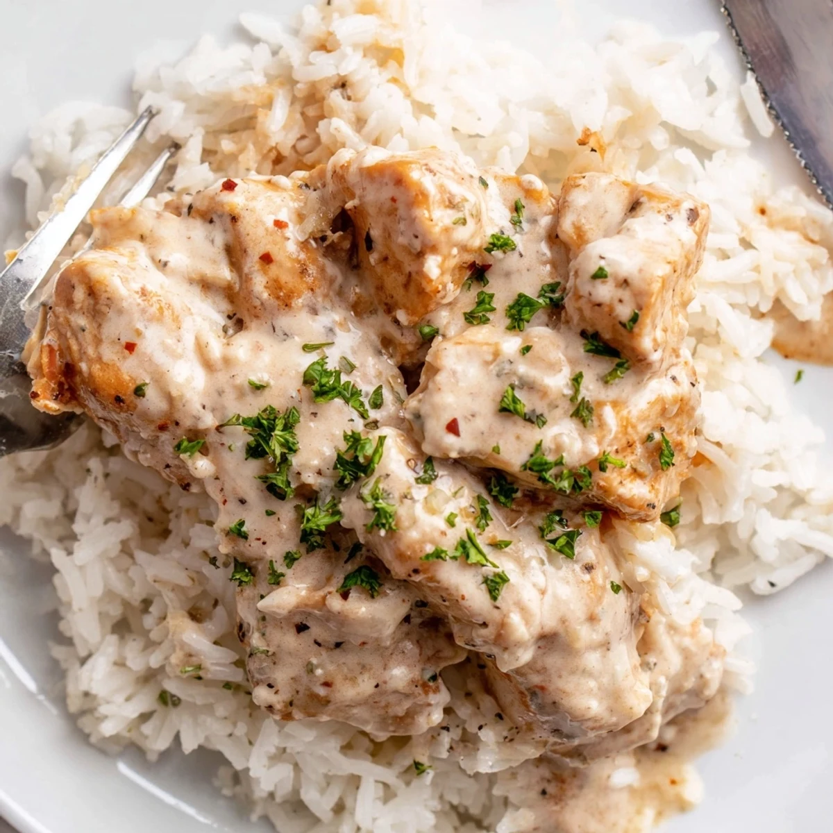 Golden baked angel chicken rice casserole with tender juicy meat and creamy parmesan sauce