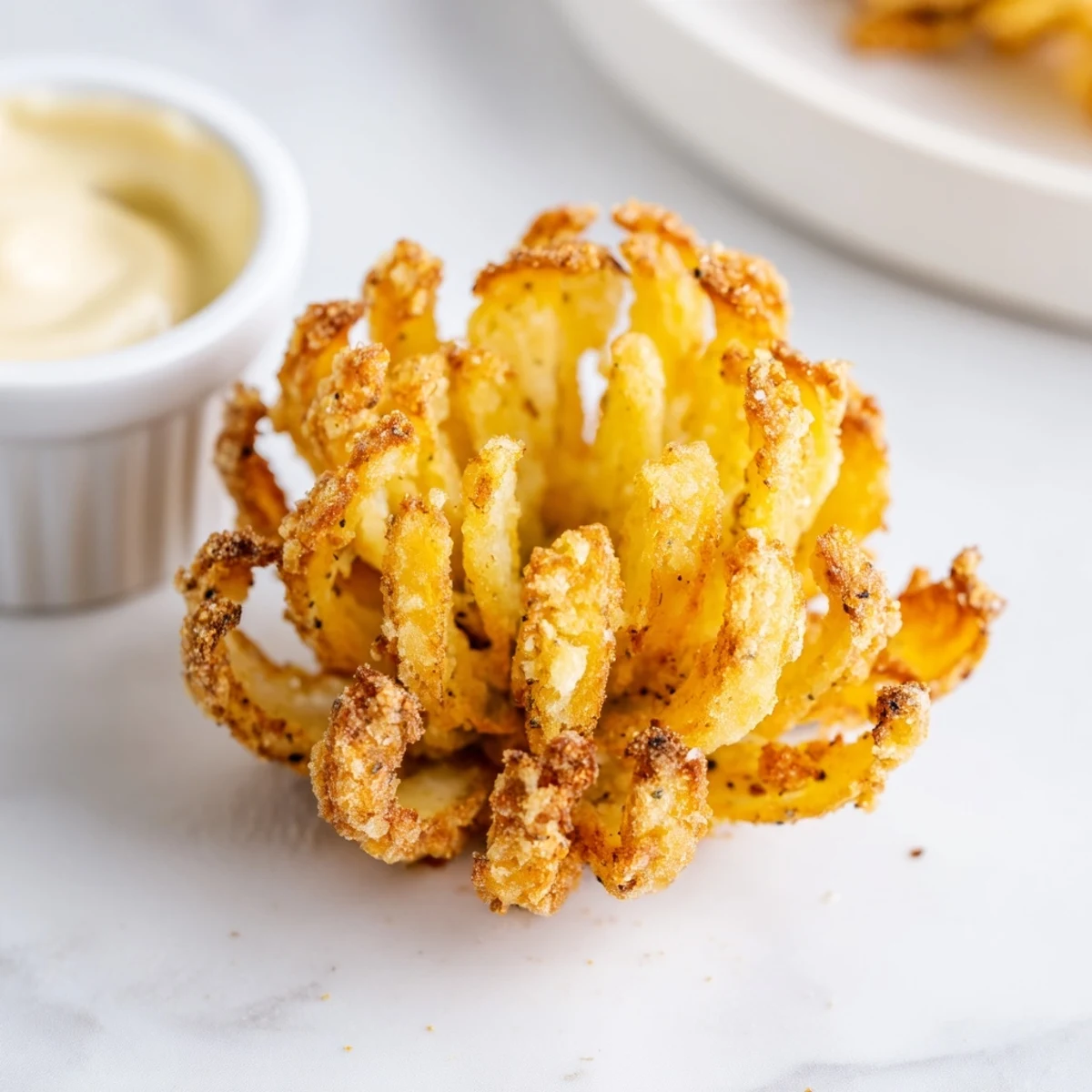 Crispy Mini Bloomin Onions Recipe on paper towels, oil-glazed edges, ready to share